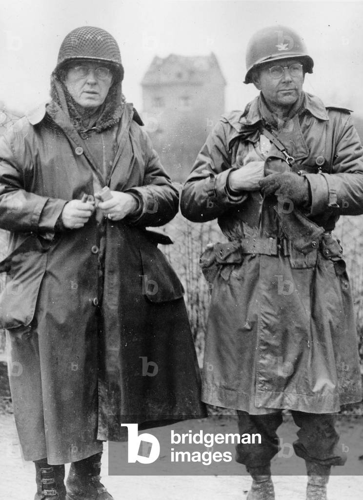 General John W Leonard, commanding general of the 9th Armored Division, and the Colonel Adna C Hamilton, executive officer of the Division, watching their soldiers crossing the river on the Remagen's bridge march 7, 1945