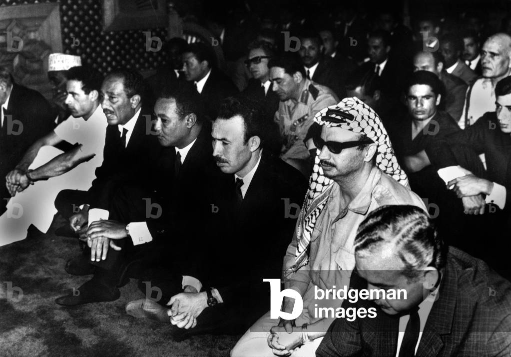 Some members of the arab unity in l. Muammar Gaddafi chief of the Libya, then Anwar Sadat egyptian state man and Yasser Arafat chief of the OLP during Gamal Abdel Nasser's funeral in Caire, on october 1970