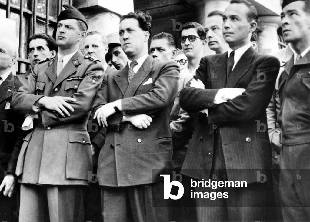 Colonel Rol-Tanguy leader of Resistance is showing Denfert Rochereau square in paris to foreign delegates of resistance, on his left Louis Saillant and General Alfred Malleret Joinville, photo published in NewYorkTimes
