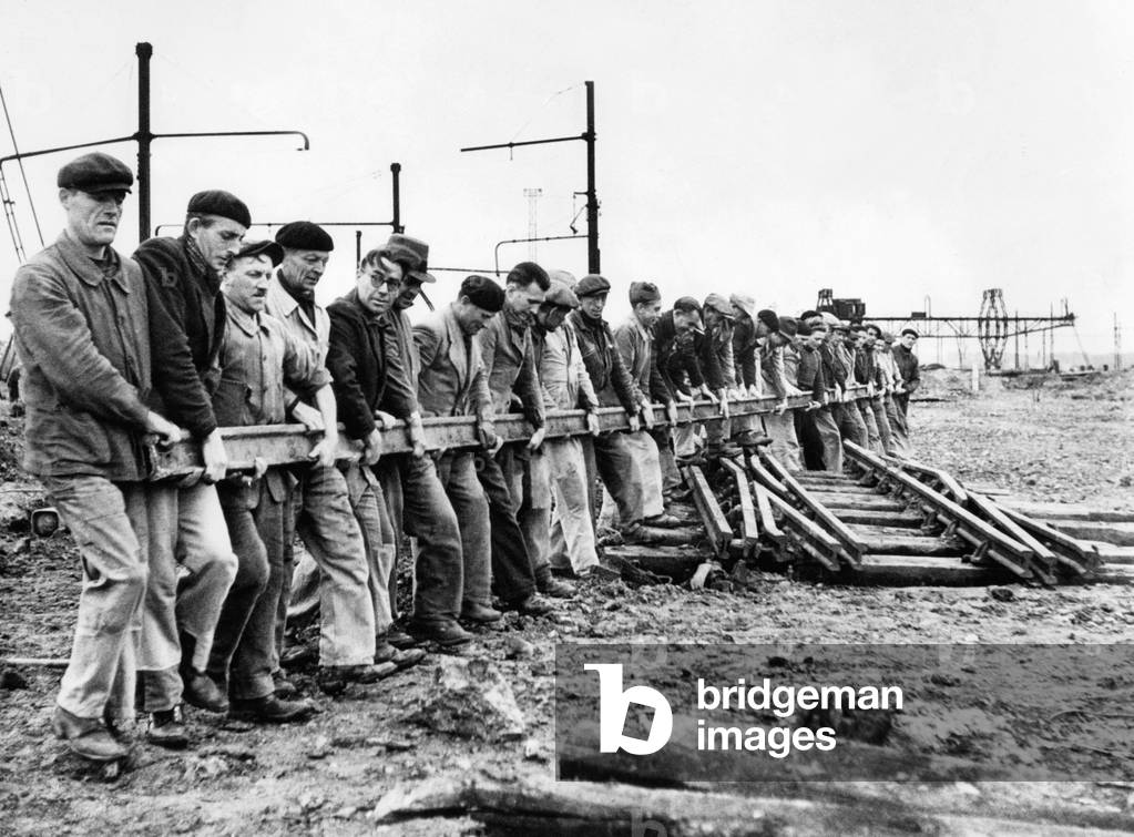 French workers repairing railways after bombing, 1944