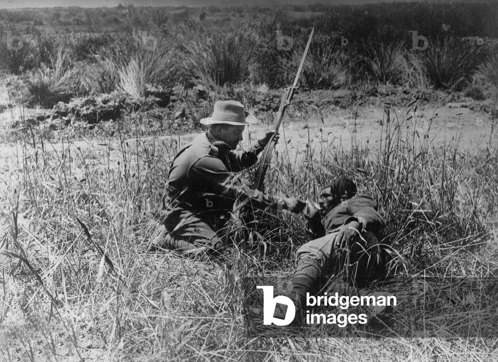 In Gallipoli (the Dardanelles, Turkey) an english soldier is giving some drink to a Turkish wounded soldier, 1st world war. Gallipoli campaign must lead the Allies to win against the Turcs but it was a reverse