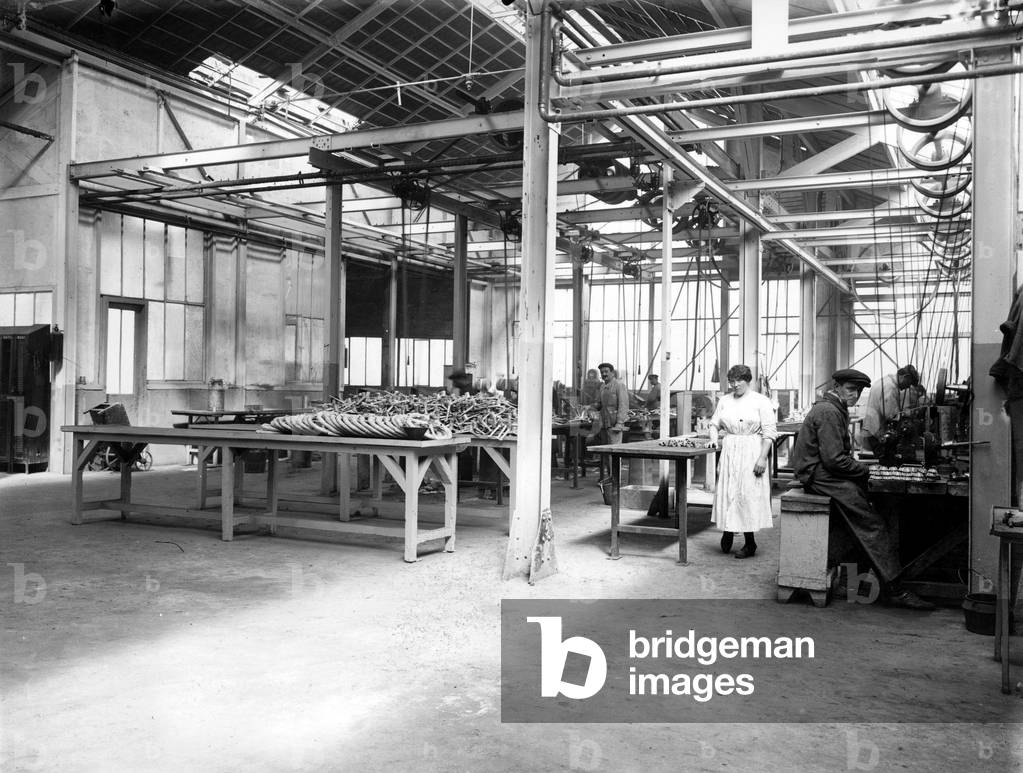 Workers in spare parts workshop in Citroen car factory, c. 1920, Paris