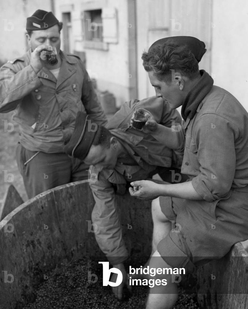 On october 9, 1944, French soldiers attached to a French armored unit sample freshly-made wine, photo NARA