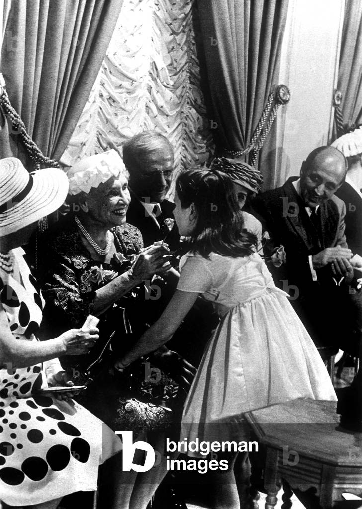 Helen Keller receiving flowers for her 80th birthday from young actress Patty Duke, 1960. Helen Keller (1880-1968) born blind deaf mute, thanks to her governess she overcame this handicaps, studied and created in1921 the american foundation for the blind