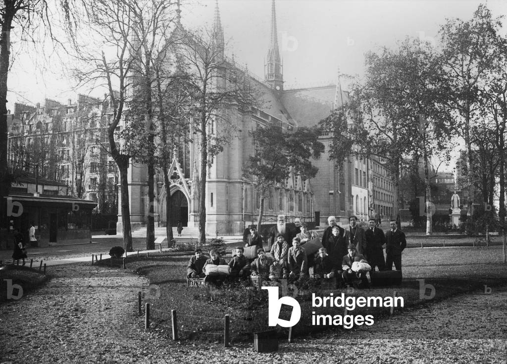 Priest Daniel Brottier (1876-1936) in the garden of the orphanage in Auteuil in the background the Sainte Therese chapel