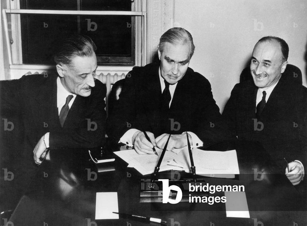 Jean Monnet (r) representant of French government in Washington on February 28, 1945 surrounds by l-r of Henri Bonnet, French ambassador, and Joseph C Grew under Secretary of State during the signature of Lend-Lease Agreement