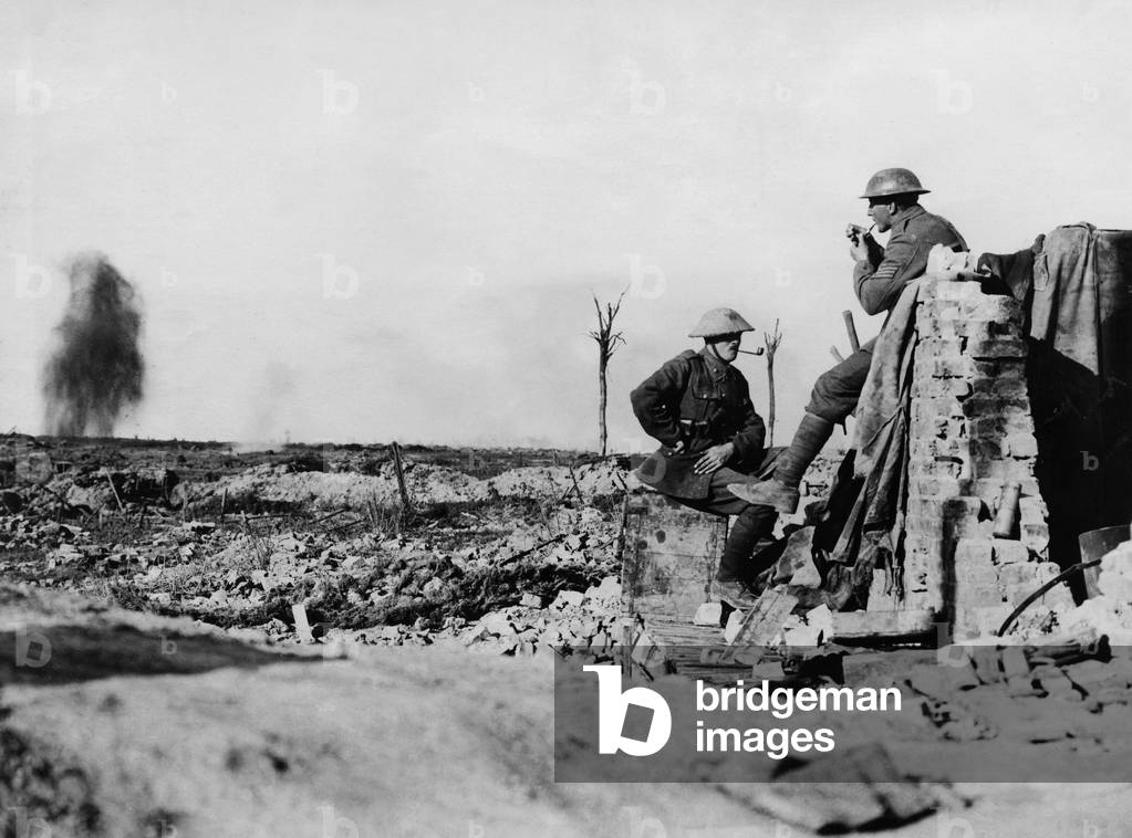 Two English soldiers smoking while bombs fall around them. Battle of Flanders, 1914