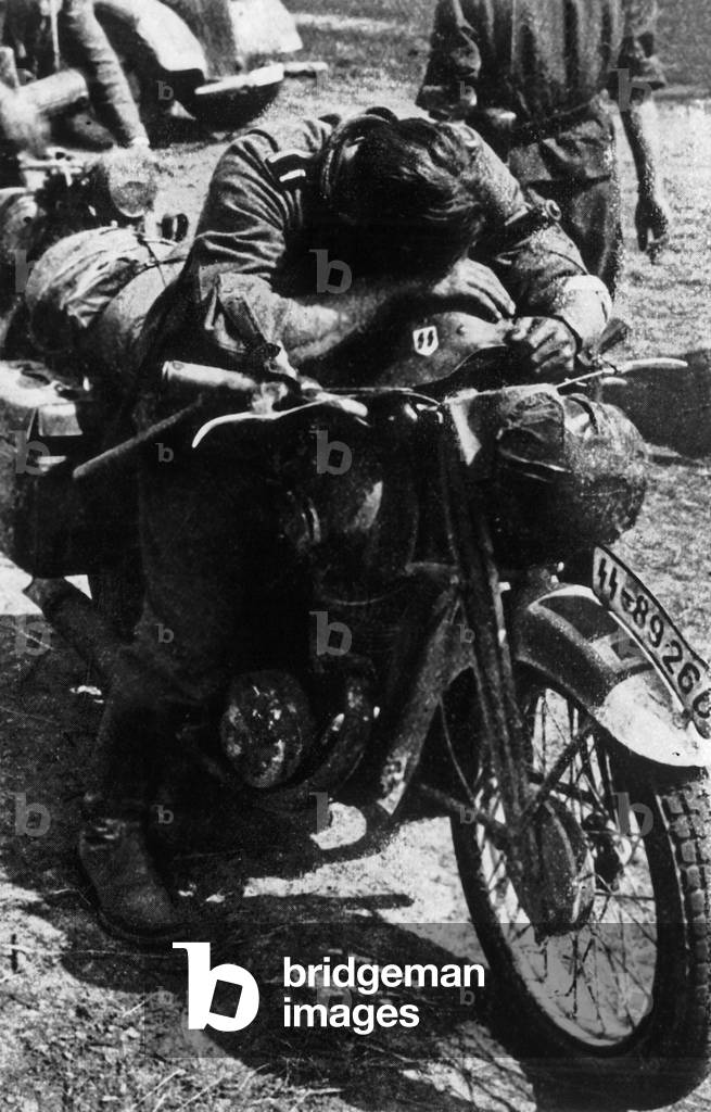 german soldier of Waffen SS sleeping on his motorbike in URSS 1941-1944