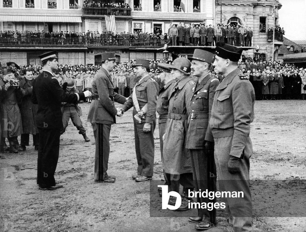 General Charles de Gaulle in Colmar (Alsace, France) on february 13, 1945 shaking hands to Jean Marie de Lattre de Tassigny, ?, general George S. Patton, general Leclerc de Hauteclocque, ?