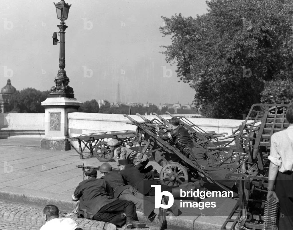 Liberation of Paris, august 1944 : FFI on barricades holding off snipers during fights for the Liberation of Paris august 26, 1944 here on a bridge over the river Seine