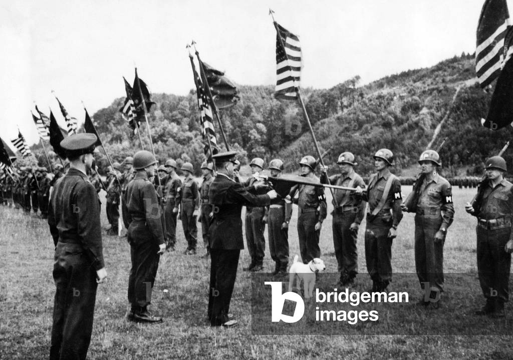 American general Jacob L. Devers presenting the famous 4th Armoured Division during parade in Lanshut Germany to celebrate their courage during the Bastogne (battle of the Bulge 1945)