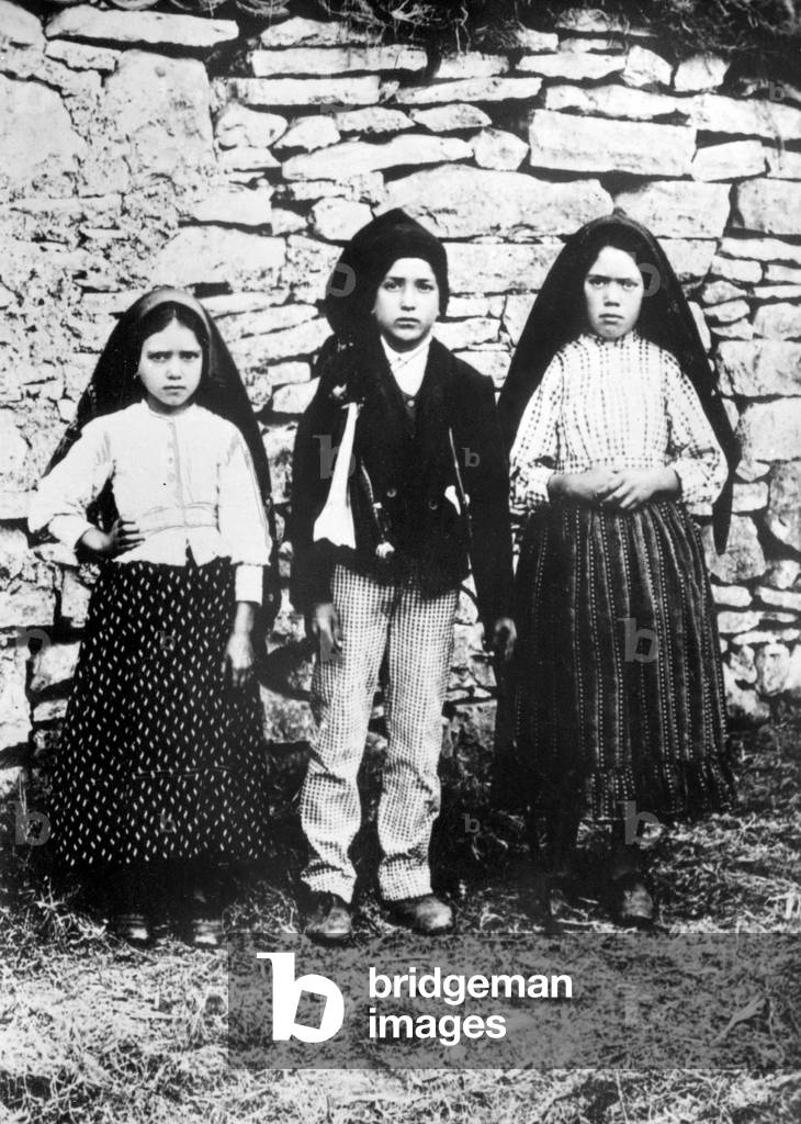 Lucia dos Santos and her cousins Francisco and Jacinta Marto in 1917 in Fatima in Portugal where Virgin Mary appeared many times