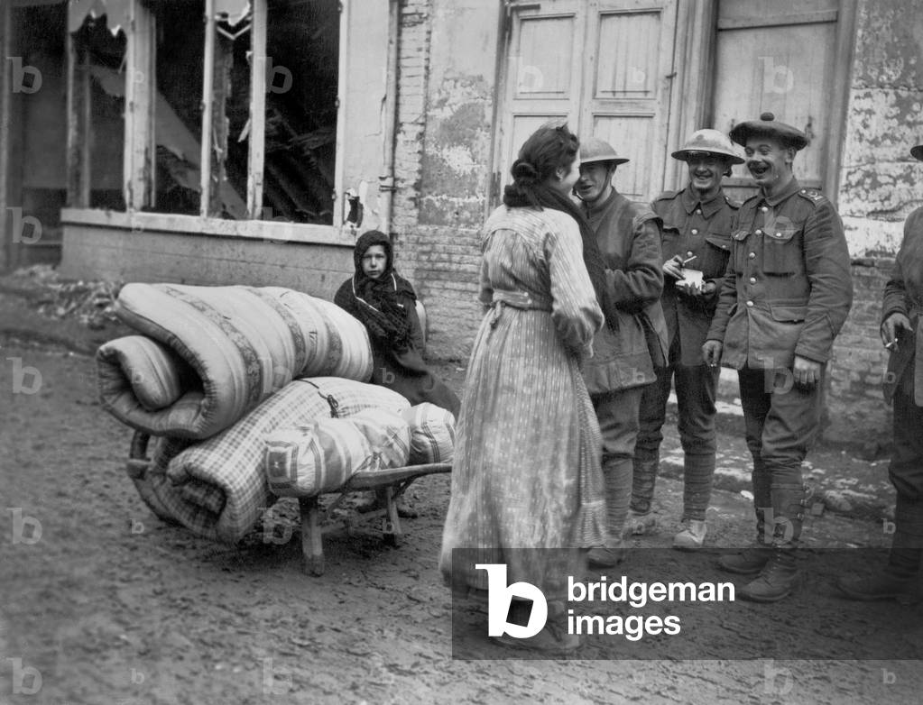 English soldiers are talking with a French woman in Nesle in the Somme between 1916