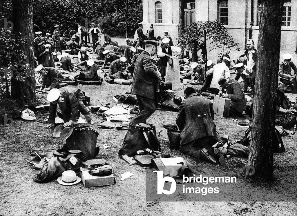 The Red Cross distribution of the uniform-clothes to the officials in the central depot Neu-Babelsberg, Germany, 1915