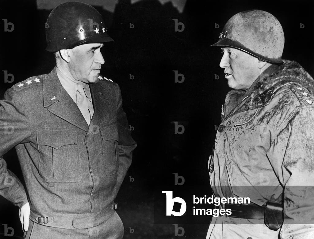 American generals Omar N.Bradley and Georges S.Patton meeting among the ruins of BAstogne during the battle of the Bulge 1944 - 1945