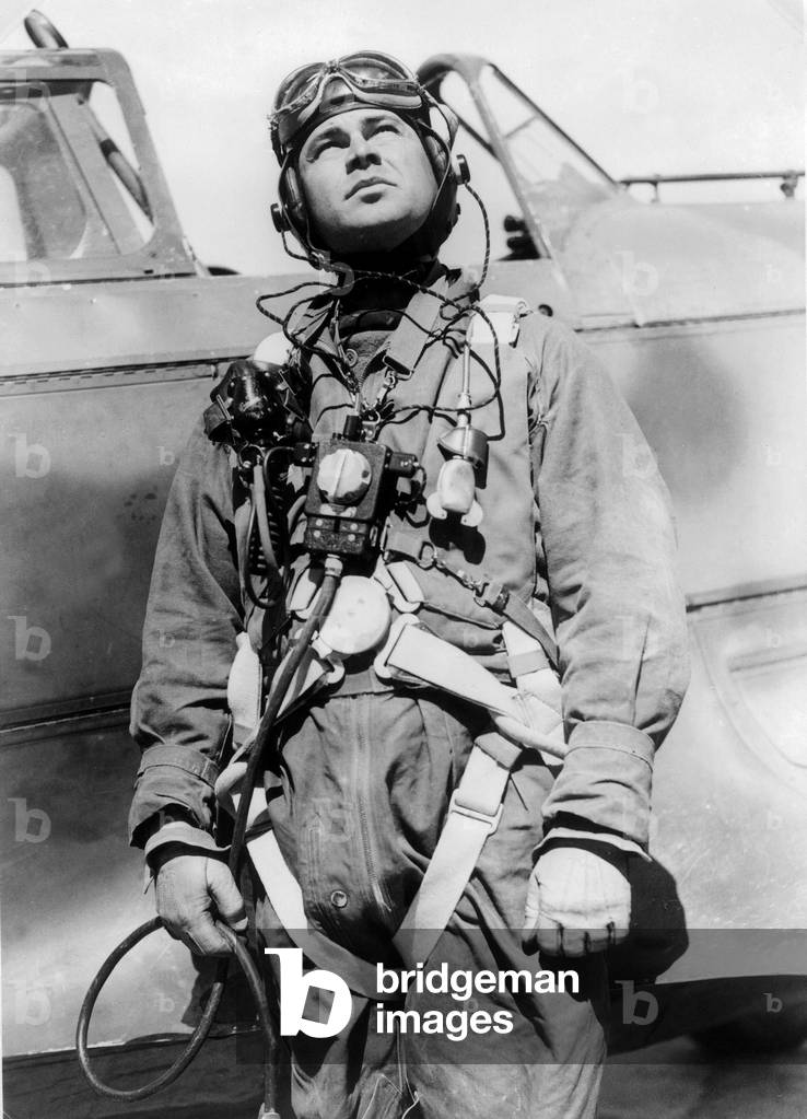 Soviet pilot in front of his plane, with his equipment, ww2