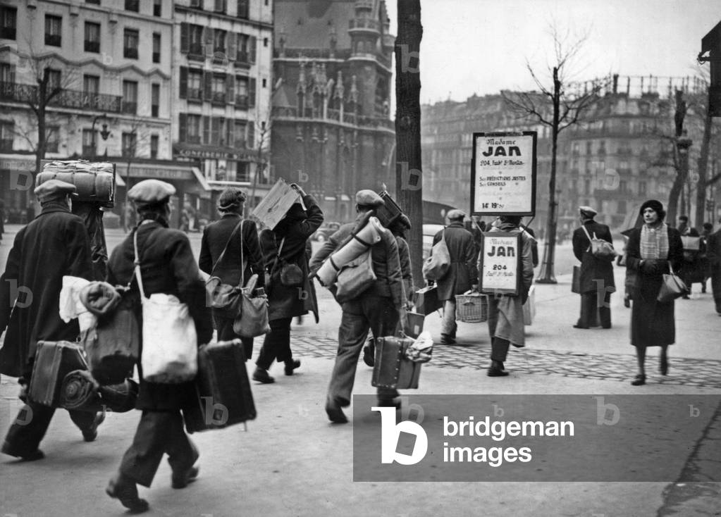 Outside station in Paris, people recruited for the STO (compulsory labour organization set up in 1943 during the German occupation of France) are going to take the train for Germany, march 1943