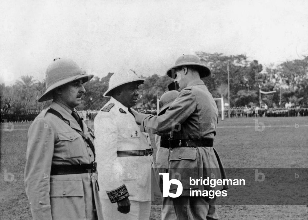 Felix Eboue (1884-1944), French colonial administrator, here awarded by general de Gaulle in Brazzaville in Congo, January 1944 (b/w photo)