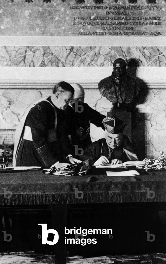 the Latran agreements signed on february 11, 1929 : agreements between papacy and italian estate on BenitoMussolini's initiative, here cardinal Gasparri, secretary of state, signing the document. On l is cardinal Francesco Borgongini
