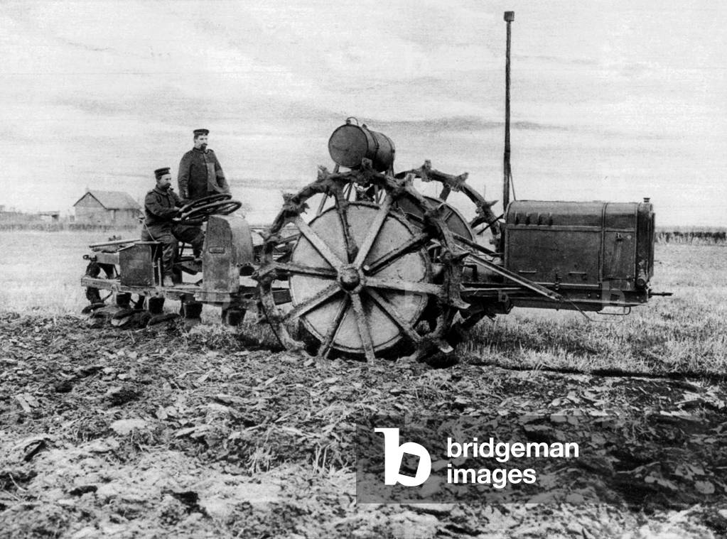 Steam motor plough plow driven by german soldiers in north of France area where agriculture is under supervision of german officers 1915