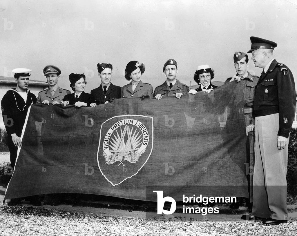 General Dwight Ike Eisenhower (1890-1969) with representative of 8 nations memebers of NATO with banner, april 4, 1949