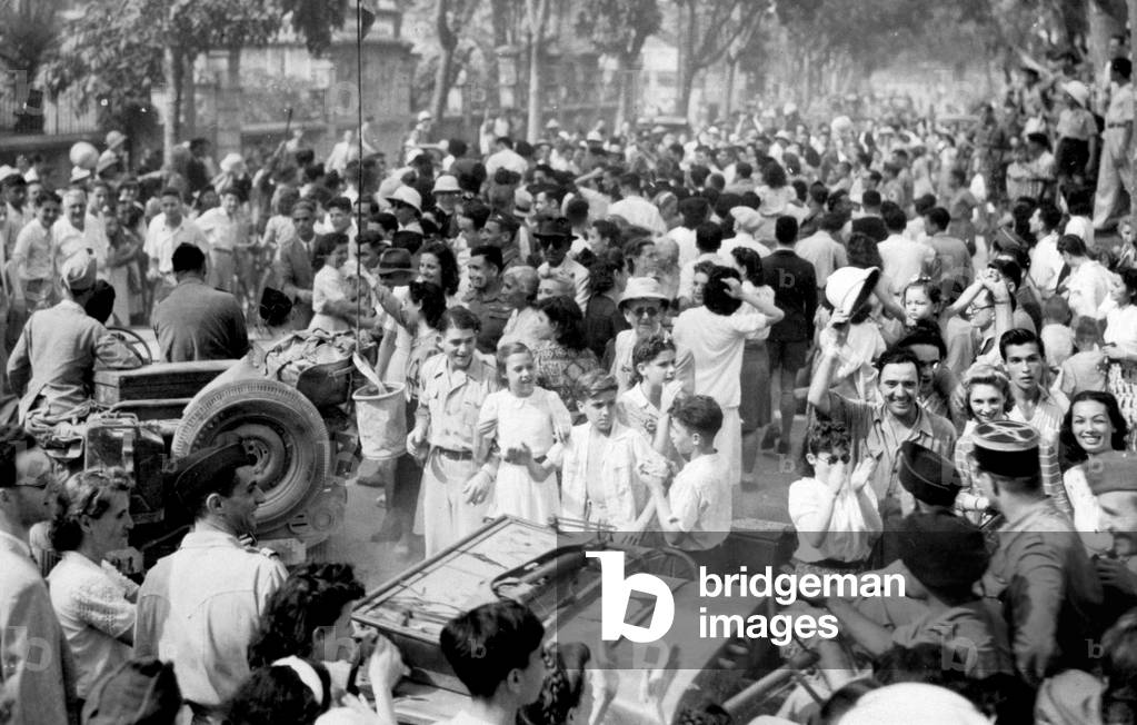 French residents greeting troops, relieved from being alone facing to the vietnamese , in Hanoi april 05, 1946