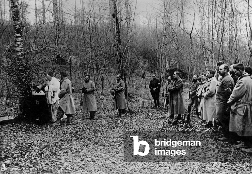 Members of the Red Cross participate in a mass in a drill during the Great War