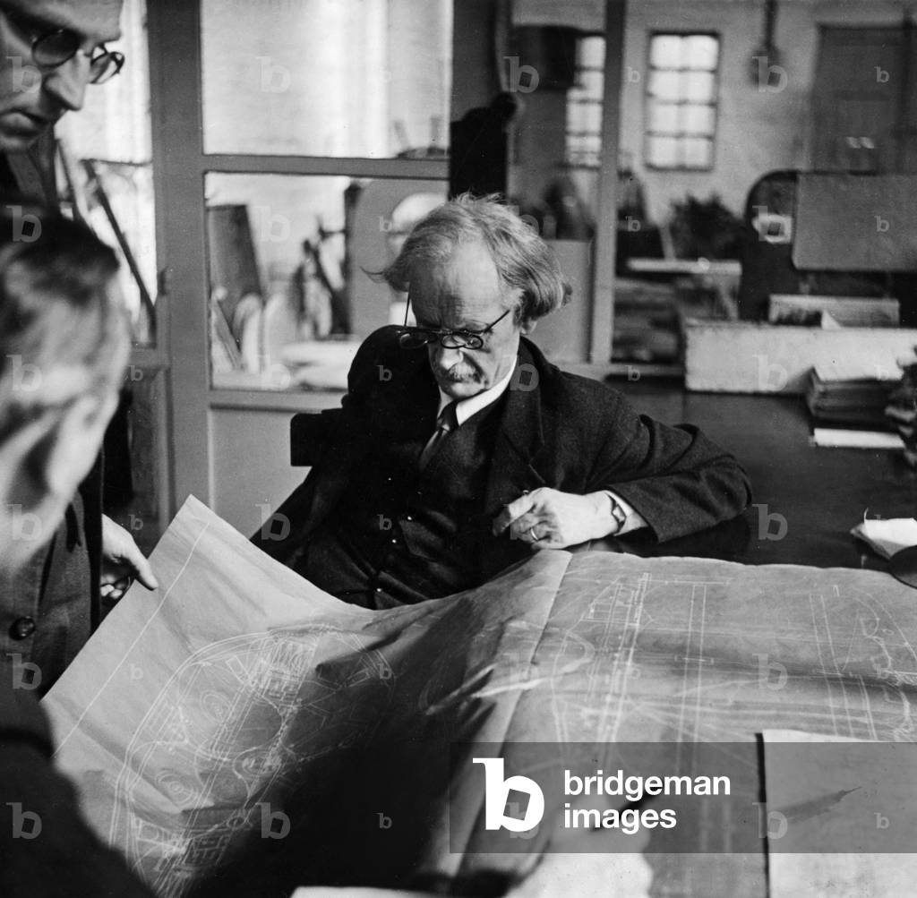 Auguste Piccard (1884-1962), swiss physicist, 1st one to explore stratosphere, here looking at the plans of the submarine which will be build by Henricot de Court-Saint-Etienne factories, late 40's