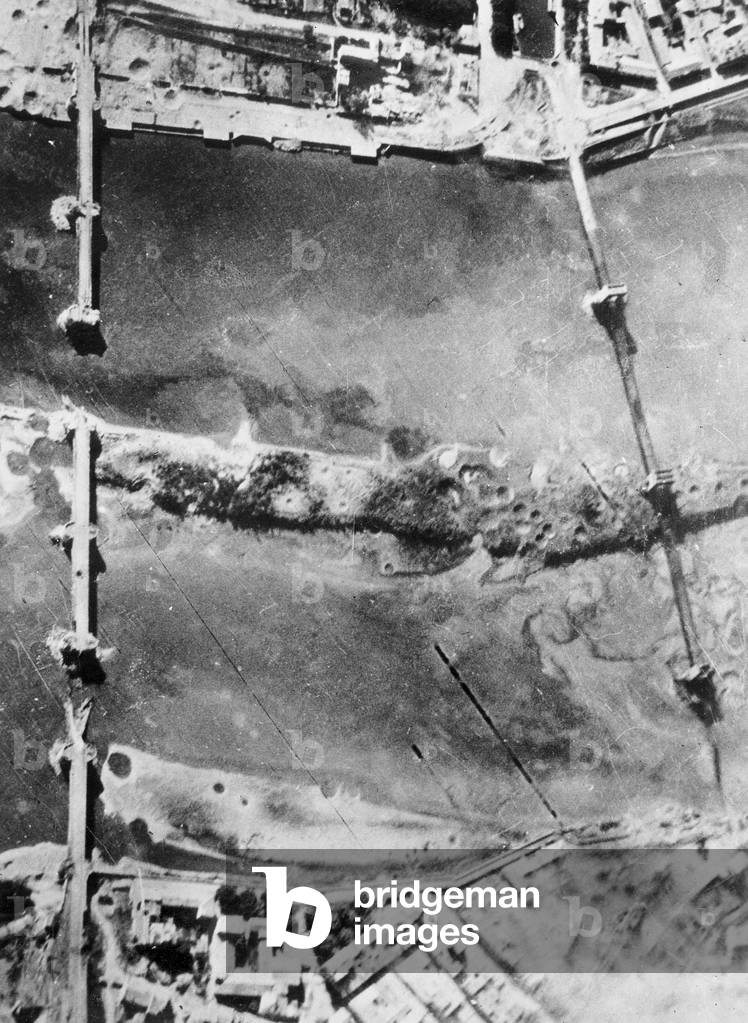 Aerial View from american bombers (B-26) bombing the german held road and rail bridges across the Rhone River at Tarascon Southern France in 1944