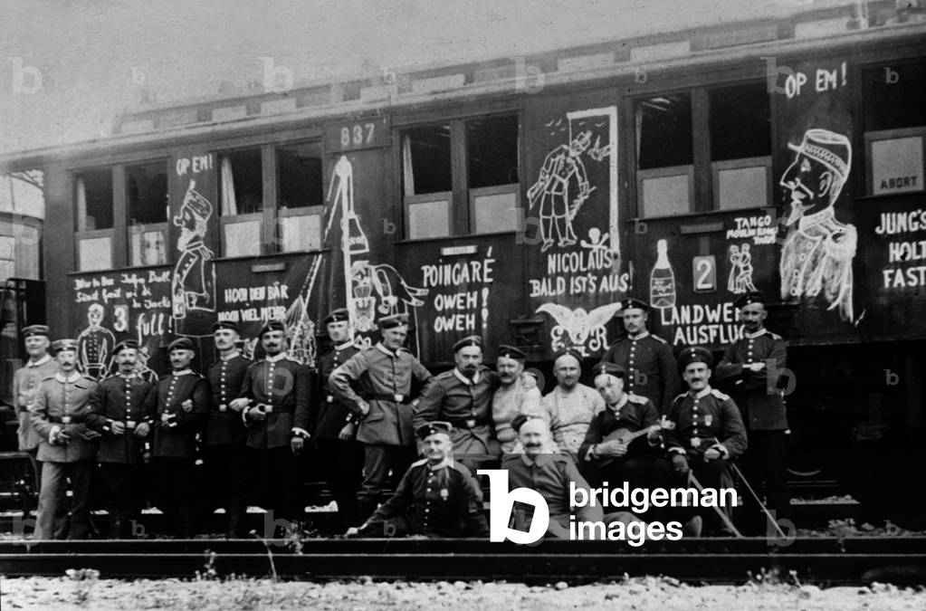german soldiers during their mobilization (august 1914) on the waggon are inscription against Poincare and Nicolas II