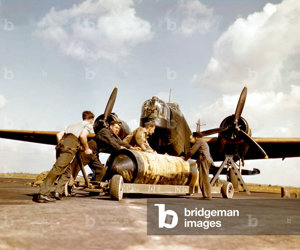 english pilots preparing bombs for their bomber during the war