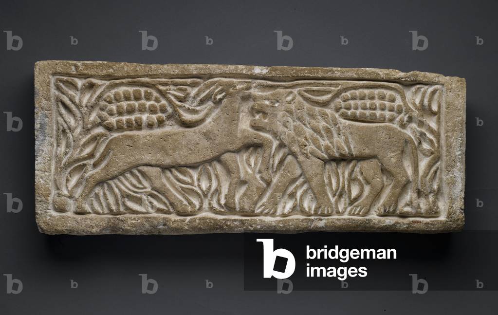 Lion attacking an antelope, from Egypt (limestone)