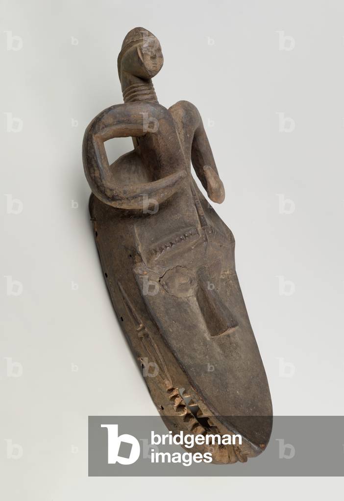Horizontal Mask (Okobuzogui), Toma culture, early 20th century (wood, clay, copper alloy)
