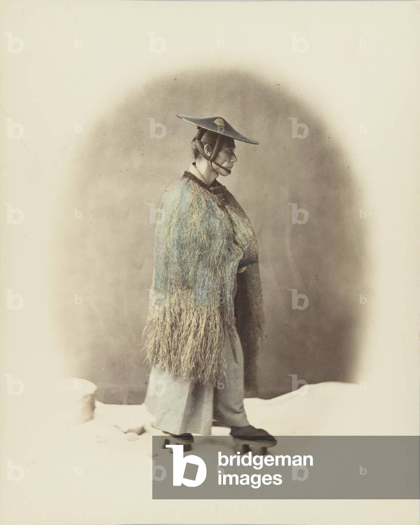 Japanese man in traditional dress (hand-coloured b/w photo)