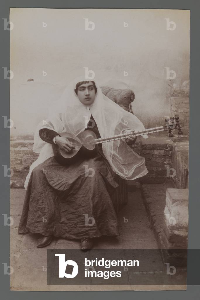 Woman seated playing a six-string Persian lute (silver albumen photo)