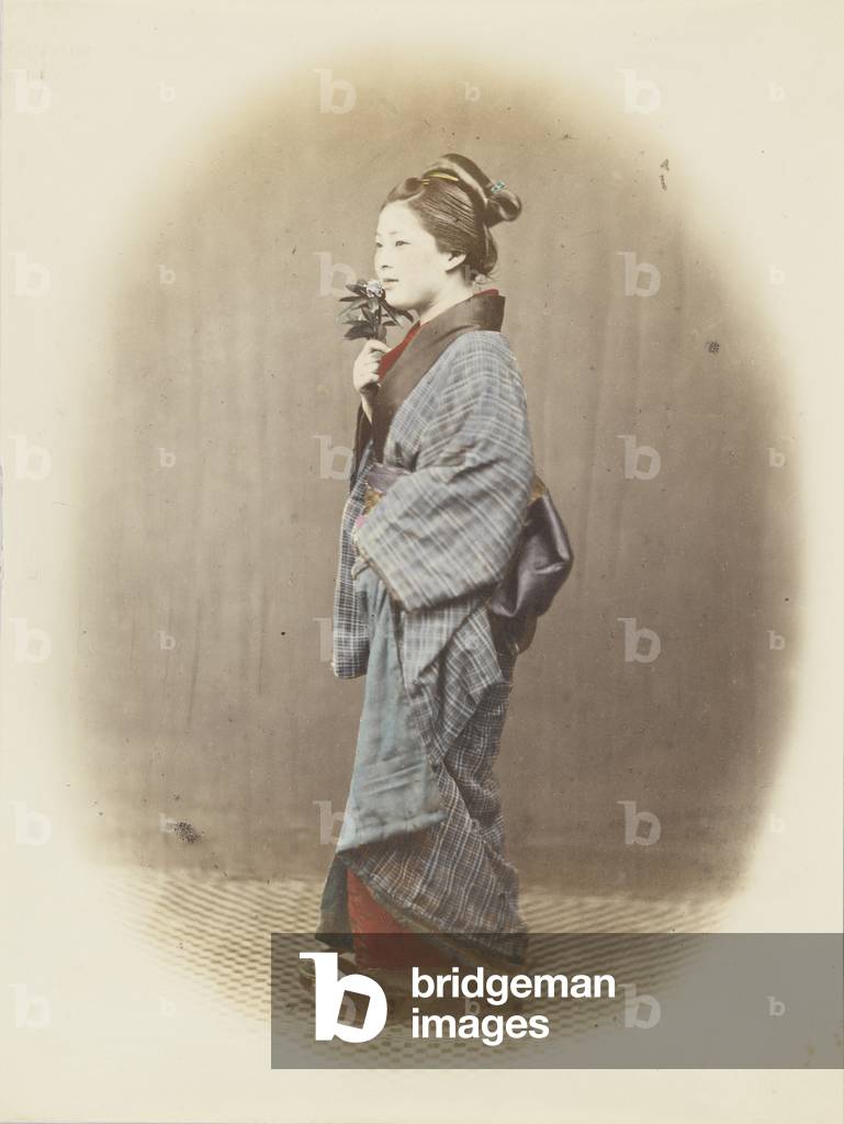 Japanese woman in traditional dress (hand-coloured b/w photo)