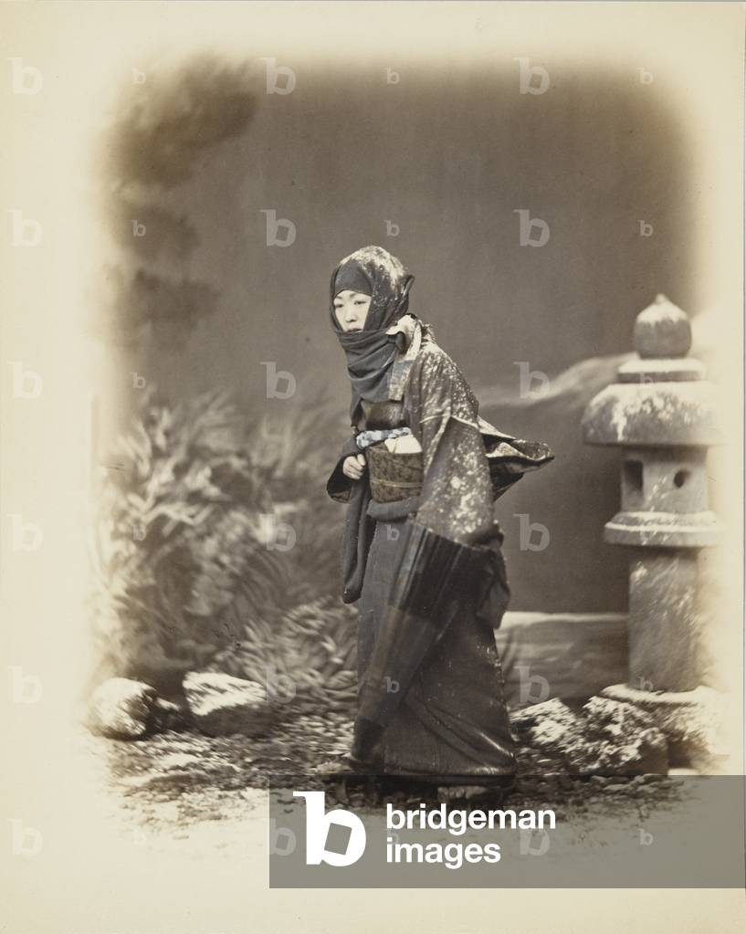 Japanese woman in the snow (hand-coloured b/w photo)