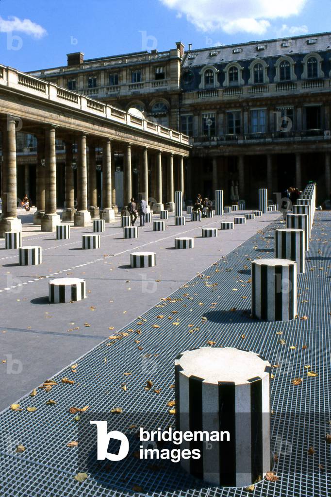 Daniel Buren's columns in Paris with in the background the Ministry of Culture, Jardins du Palais Royal, Paris. The columns that grid the court were added in 1986 following a public order from the Ministry of Culture.