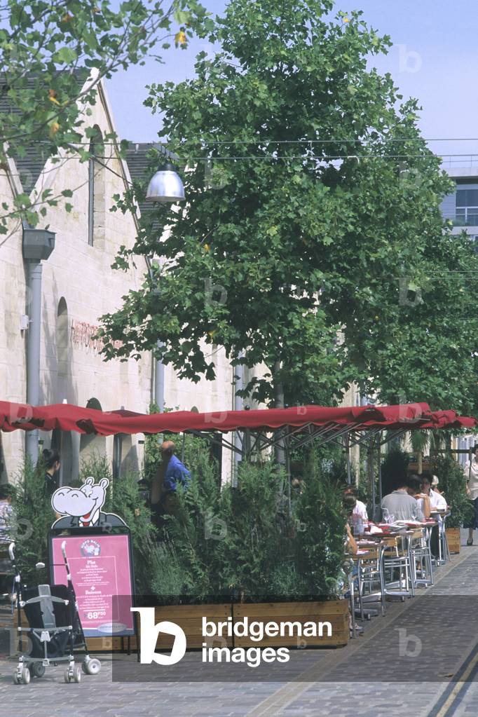 Bercy Village, Paris 12th arrondissement. Installed on part of Bercy's old warehouses, which declined until the sixties. This new commercial urbanism wanted to keep some traces of the old wine and spirits trading center. Shops have opened in old cellars and traces of railway tracks carrying wine have been preserved.