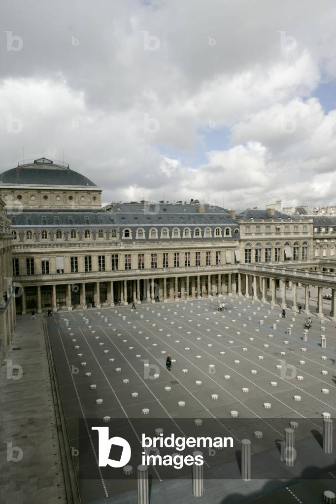 Daniel Buren's columns in the Royal Palace Gardens seen from the Ministry of Culture, rue de Valois in Paris. The columns that grid the court were added in 1986 following a public order from the Ministry of Culture. Photography 19/04/05.
