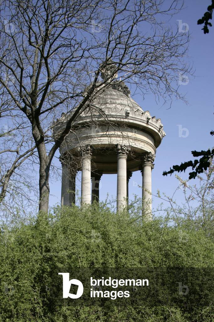Parc des Buttes Chaumont, Paris 19th arrondissement. View of the island with at the highest point a reproduction of the temple known as the Sibyl in Tivoli, architect Gabriel Davioud (1824-1881). On the will of Napoleon III (1808-1873) to provide the laborious classes with green lungs, the park was converted to ancient gypsum quarries, which explains its topography. Adolphe Alphand (1817-1891), grand authorizer of Parisian parks with architect engineer Alfred Darcel (1818-1893) drew up the plan of the park. The landscape artist Pierre Barillet Deschampsæ (1824-1873) planted the park from 1866 onwards.
