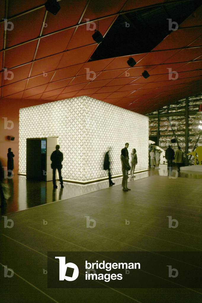 Louis Vuitton Island (Les Iles du Reel), in the French pavilion of the World Exposition in Aichi, Japan, 2005. Louis Vuitton Island, designed by Gerard Cholot, presents a Carbon Balance Sheet that allowed Louis Vuitton to set priorities to reduce significantly its greenhouse gas emissions. A pure white light reveals a facade of salt and sea tiles, symbolic material for the sustainable management of the planet's resources. The visual and sound project is by Marc Heymann.