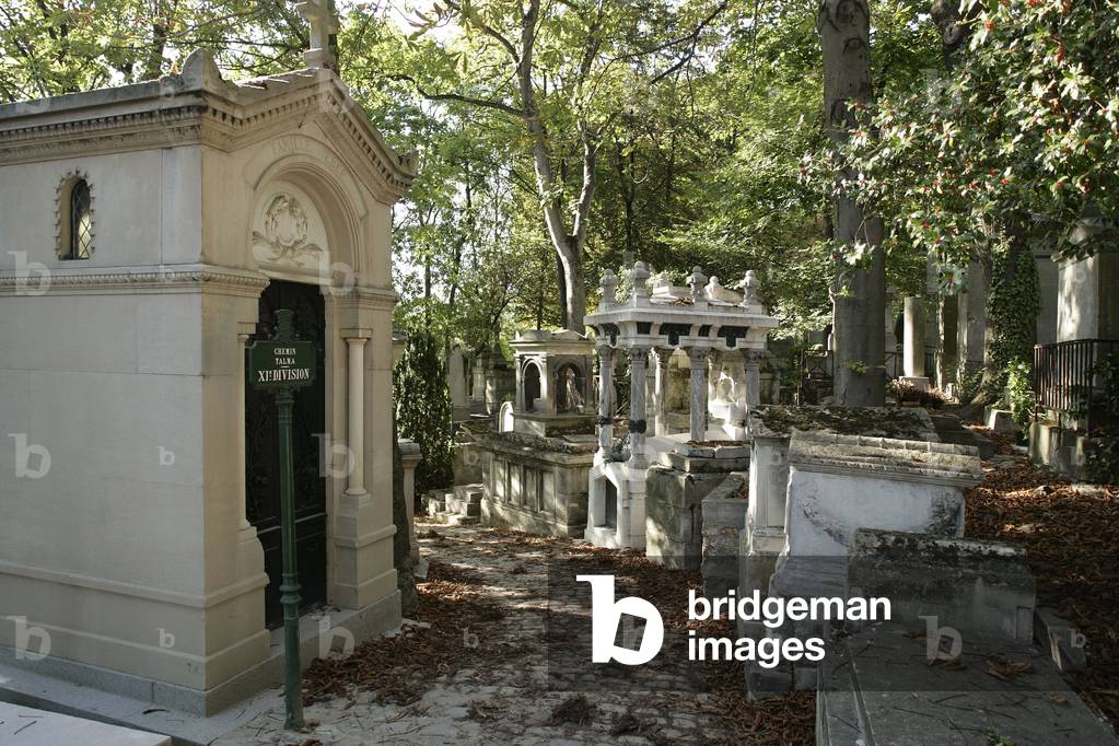 The cemetery of Pere Lachaise in Paris. The cemetery opened around 1804 on a land formerly owned by the Jesuit. The architect Alexandre Theodore Brongniart conceived the plans of 1810. Many artists worked at Pere-Lachaise in the first half of the 19th century. With an area of almost 44 hectares, it counts about 70 000 monuments.ÆPhotograph 06/06/05.