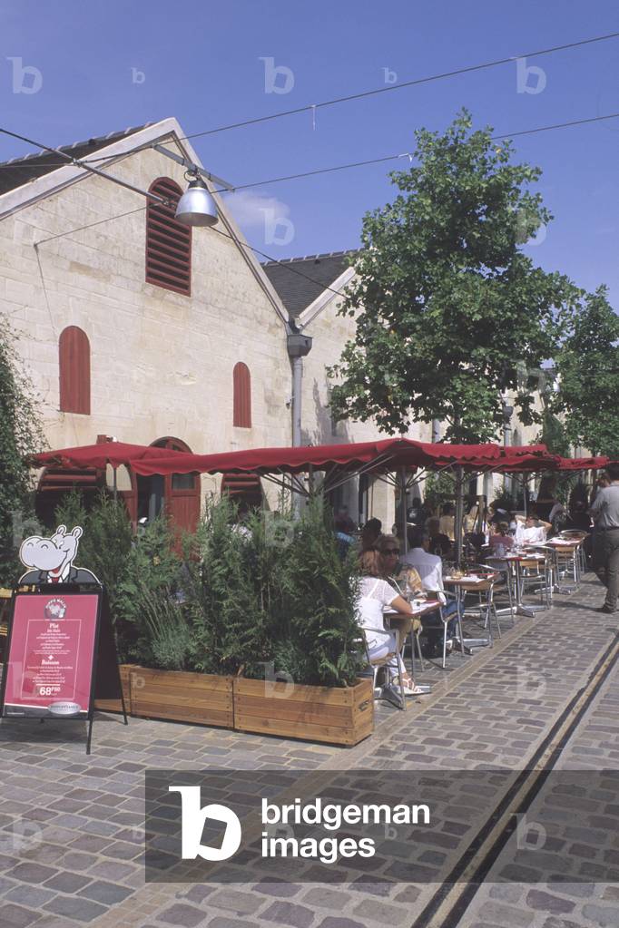 Bercy Village, Paris 12th arrondissement. Installed on part of Bercy's old warehouses, which declined until the sixties. This new commercial urbanism wanted to keep some traces of the old wine and spirits trading center. Shops have opened in old cellars and traces of railway tracks carrying wine have been preserved.