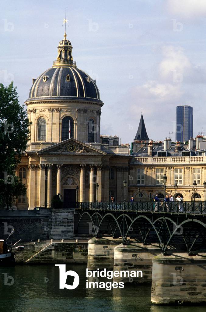 Pont des Arts, Paris 6th arrondissement. Reconstruction in 1981 by Louis Arretche. The Passerelle des Arts, the first iron bridge in Paris, had the mission of joining the Institut de France and the Louvre, which was then called the Palais des Arts. Reserved for pawns, it was built from 1801 to 1804. It initially consisted of nine arches. Following numerous river accidents, its reconstruction was decided in 1981 but two arches were removed to line them up on the Pont Neuf.