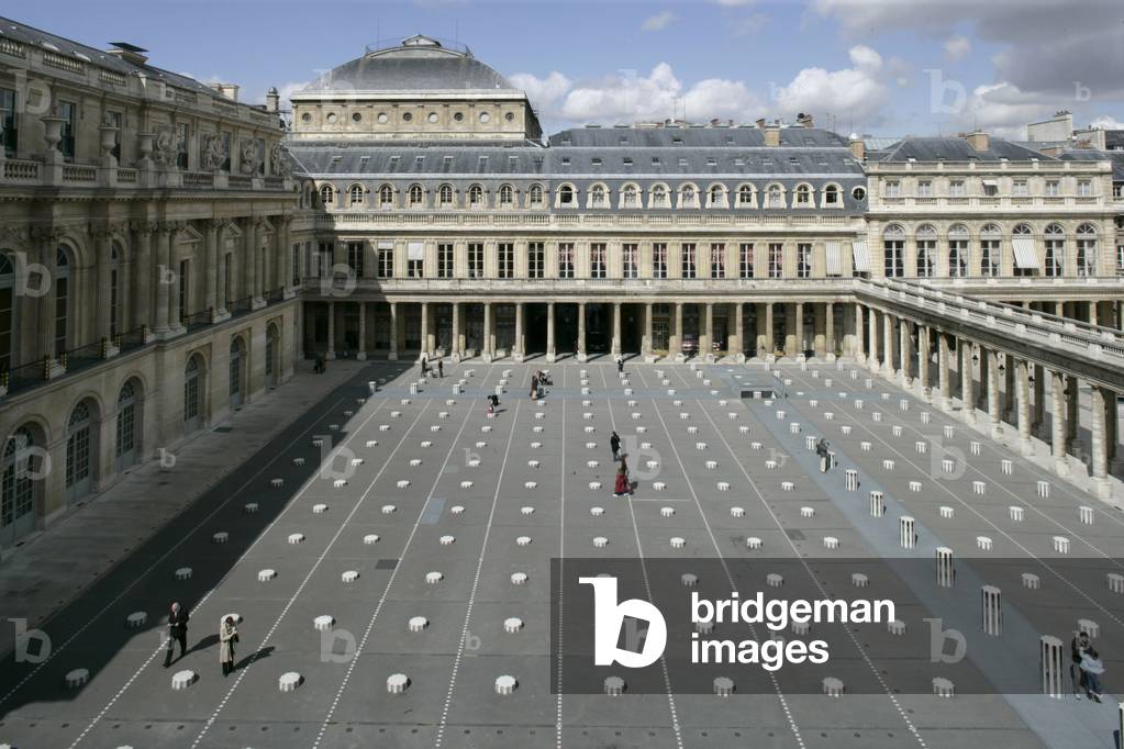 Daniel Buren's columns in the Royal Palace Gardens seen from the Ministry of Culture, rue de Valois in Paris. The columns that grid the court were added in 1986 following a public order from the Ministry of Culture. Photography 19/04/05.