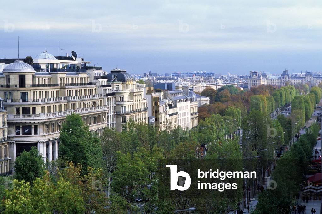 Avenue des Champs Elysees, Paris 8th arrondissement. It was Jean Baptiste (Jean-Baptiste) Colbert (1619-1683) who had Andre Le Notre (1613-1700) opened in 1667 an avenue starting from the Tuileries to reach a hill, today called L'Etoile. There's nothing left from that time. Only nineteenth century witnesses remain on the Champs Elysees. Bernard Huet was asked in 1994 to bring back the Champs Elysees in order to restore its prestige to the avenue: the cars were driven from the allees, an underground car park created, the floor covered with grey granite slabs. The promenade aspect was reinforced by the planting of a second row of plane trees and new constraints were defined for signs and windows.