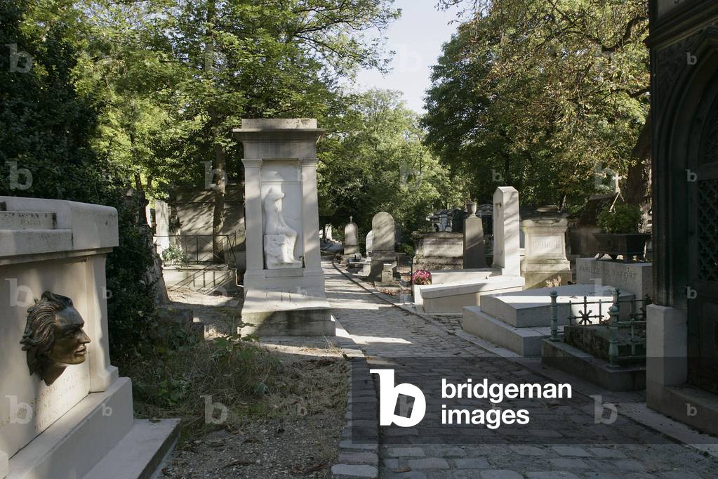 The cemetery of Pere Lachaise in Paris. The cemetery opened around 1804 on a land formerly owned by the Jesuit. The architect Alexandre Theodore Brongniart conceived the plans of 1810. Many artists worked at Pere-Lachaise in the first half of the 19th century. With an area of almost 44 hectares, it counts about 70 000 monuments.ÆPhotograph 06/06/05.