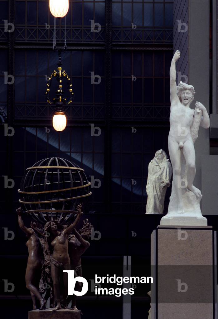 Sculpture in the grand nave of the Musee d'Orsay, 1 rue de Bellechasse, Paris 75007. Architects of rehabilitation: ACT Architecture and Gae Aulenti, 1980-1986. Former Gare d'Orsay, built by Victor Laloux and inaugurated for the Universal Exhibition in Paris on 14 July 1900. Saving from demolition, the former station became a museum for national art collections from 1850 to 1914.