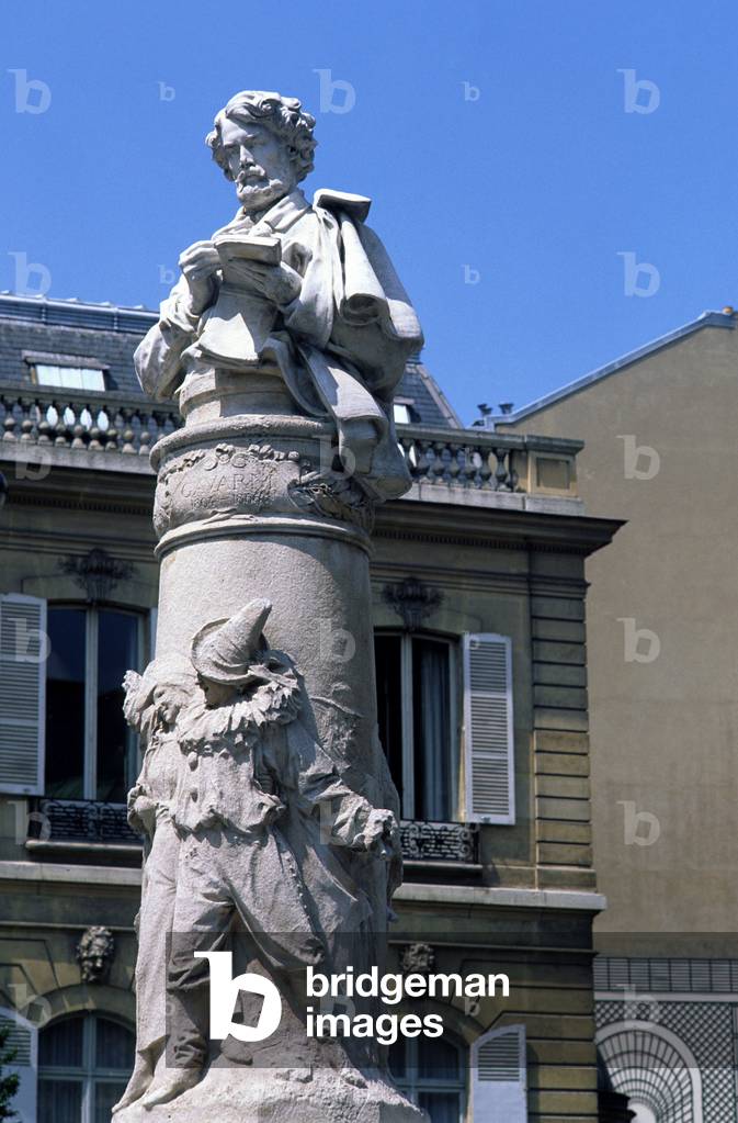 Statue of Paul Gavarni (or Sulpice Guillaume Chevalier, 1804-1866), Place Saint Georges in Paris 9th. Sculptor D. Ruech.